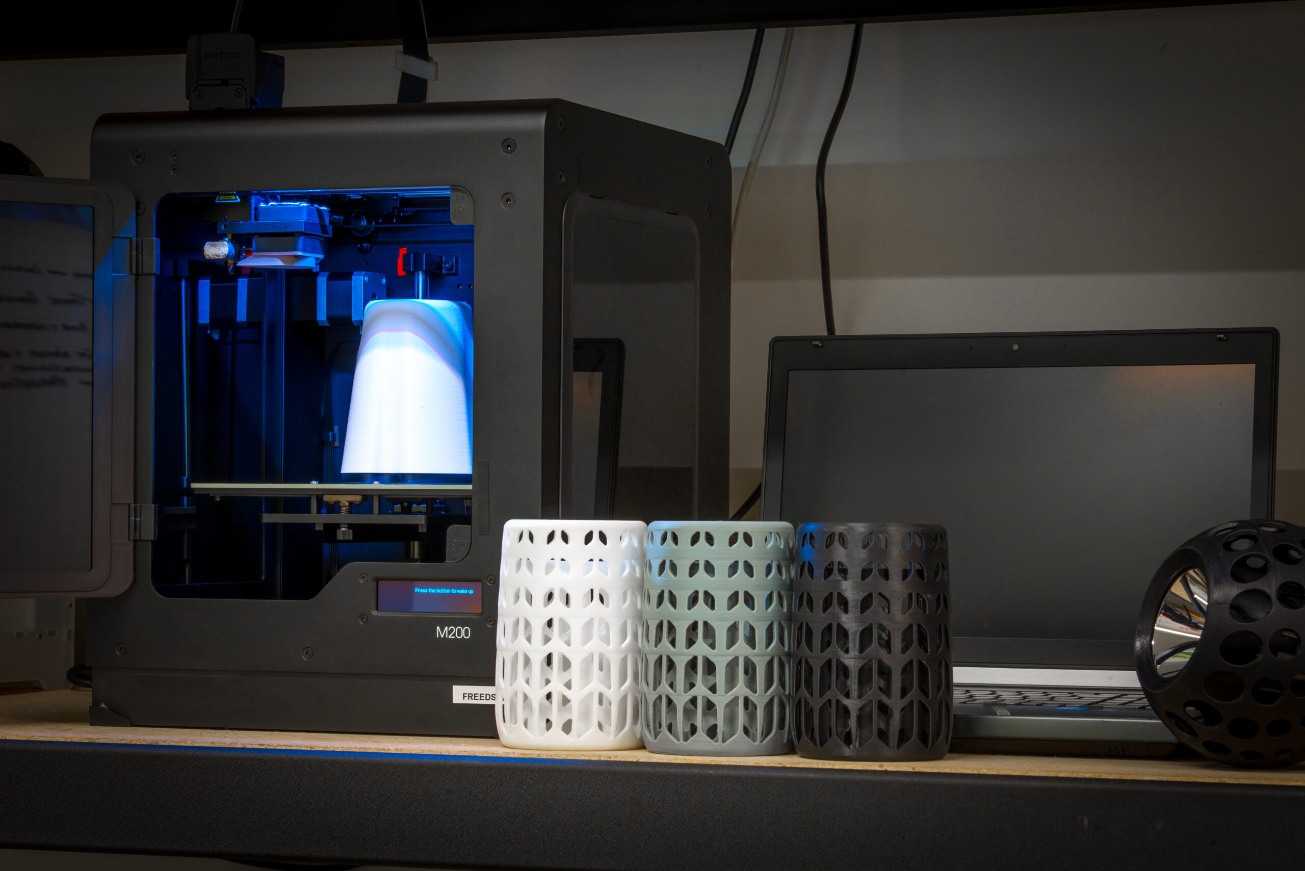 Image of 3D printer with 3D printed lamp cover